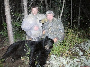 They pose with their Ontario Black Bear, hunting trip