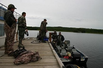hunters gathering on a boat at dog lake in ontario