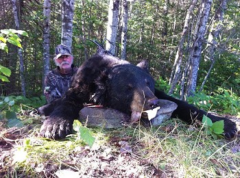 Black Bear Trophy Catch and Hunter posing