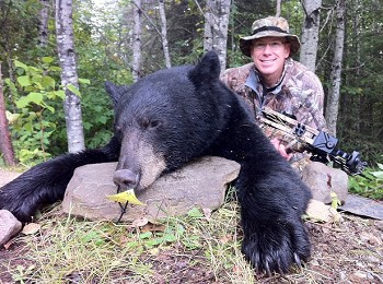 Hunter with black bear, Dog Lake Resort, fishing and hunting in Ontario