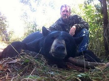 Merles Bear, posing with hunter