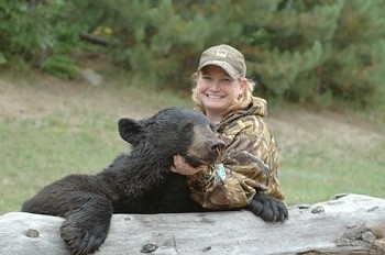 Michelle Hemstalk poses with a black bear