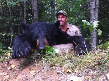 Proud hunter shows off their trophy black bear in 2011