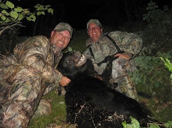 Black Bear hunting in Ontario, two hunters and their black bear