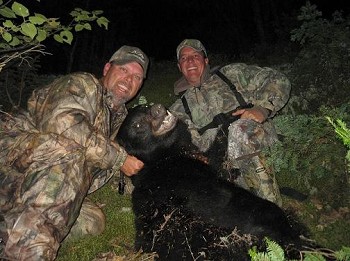 Black Bear hunting in Ontario, two hunters and their black bear
