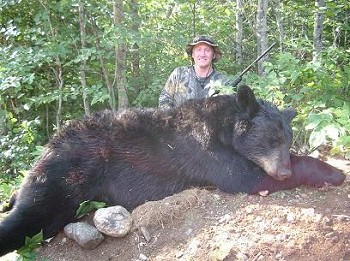 Greg Jenik poses with his trophy black bear